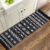 GOMUVIN Boho Runner Rugs 2’x8′, Black and White Area Rug with Tassel, Woven Washable Hallway Runner Moroccan Cotton Rug Throw Rugs Decor for Bedroom Living Room Laundry