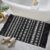 GOMUVIN Boho Bathroom Rug 2’x3′, Small Black and White Area Rug with Tassel, Woven Washable Moroccan Cotton Rug Bath Mat Throw Rugs for Bedroom Hallway Laundry Door